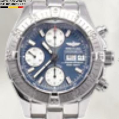 a close up of a watch with a blue face