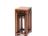an image of a small wooden table with a basket on top of it