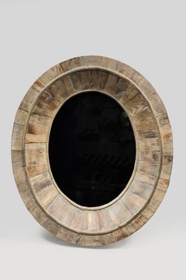 a picture of a round wooden object with a black hole in the middle