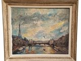 Un tableau représentant la tour Eiffel est présenté dans un cadre doré.