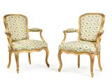 pair of louis xv style armchairs with floral upholstered upholstered arms