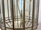 a glass lamp that is on top of a table