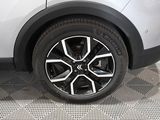 a close up view of a car ' s wheel on the floor