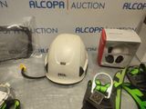 a helmet, gloves, and other items on a table