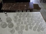 a lot of empty wine glasses on a table