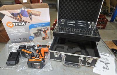 a tool case with tools on a table next to a box