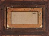 an old picture frame hanging on a wall with a picture on it