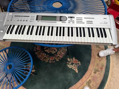 a white keyboard sitting on top of a blue chair