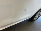a close up of a car door with a sticker on it