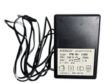 a black power supply that is attached to a white background
