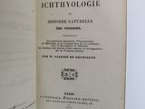 a book open on a table with a white background