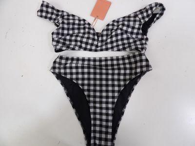 a black and white checkered bikini top with a high waist