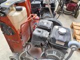 a small machine that is sitting on the ground