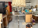 a lamp that is sitting on a stand in a room