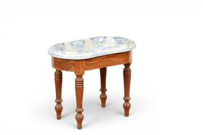 a small wooden stool with a blue and white pattern on it