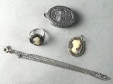 three pieces of jewelry including a necklace, ring, and bracelet