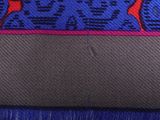 blue and red patterned fabric with red deers on a blue background