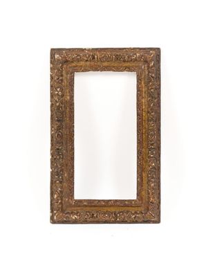 an old picture frame with a white background and a white wall