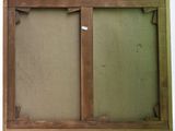 an old picture frame with a piece of fabric hanging on the wall