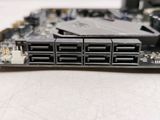 a close up of a motherboard with a hard drive attached