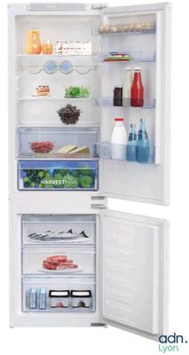 a white refrigerator with its door open and some food inside