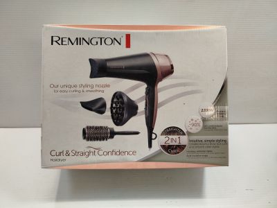 packaging of a hair dryer sitting on top of a white table