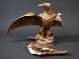 a statue of an eagle with a bird on it ' s back