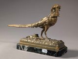 bronze pheasant on a marble base with a bird in its beak
