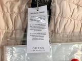 a picture of a jacket with a tag attached to it