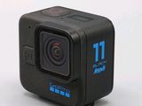 the gopro camera is sitting on a white surface with a white background
