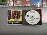 a cd on the table next to a cd case