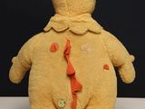 a teddy bear that is wearing a tie on it ' s back