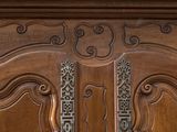 a close up of a wooden door with ornate carvings