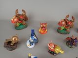many figurines of different types and colors on the table