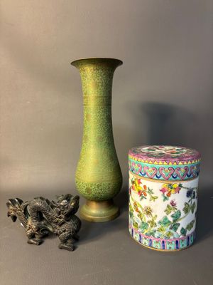 two vases and a box sitting on a table