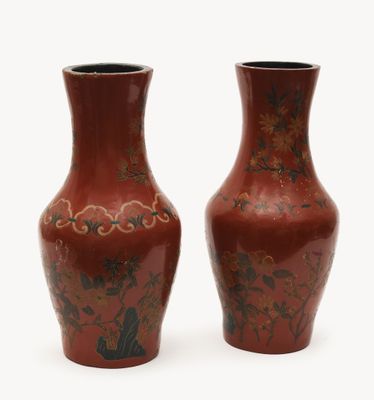 two vases sitting side by side on a white surface