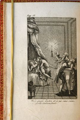 un vieux livre avec l'image d'une femme dans une pièce