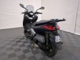 a motorcycle that is parked on a checkered floor
