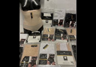 a lot of items on a table with a mannequin
