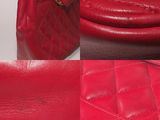 a red purse and a red handbag on a table