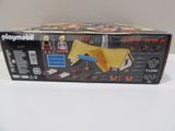 a box of playmobil with a toy horse in it