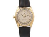 une montre-bracelet Rolex plaquée or avec un bracelet en cuir noir