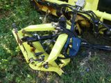 a yellow machine that is sitting in the grass