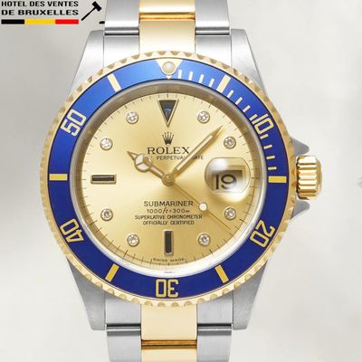 a gold and blue rolex watch with diamonds on the bezel