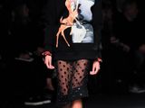 a model walks the runway at the fashion show during fashion week