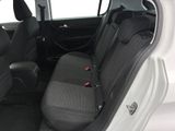 the back seats of a white car with black seats and a red seat belt