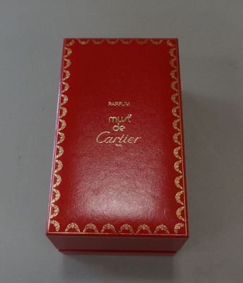 a red box with gold writing on it sitting on a table