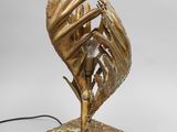 an image of a bronze sculpture of a bird on a marble base