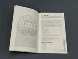 an open book with a picture of a man on it