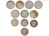 une image représentant un cœur formé de pièces de monnaie sur fond blanc